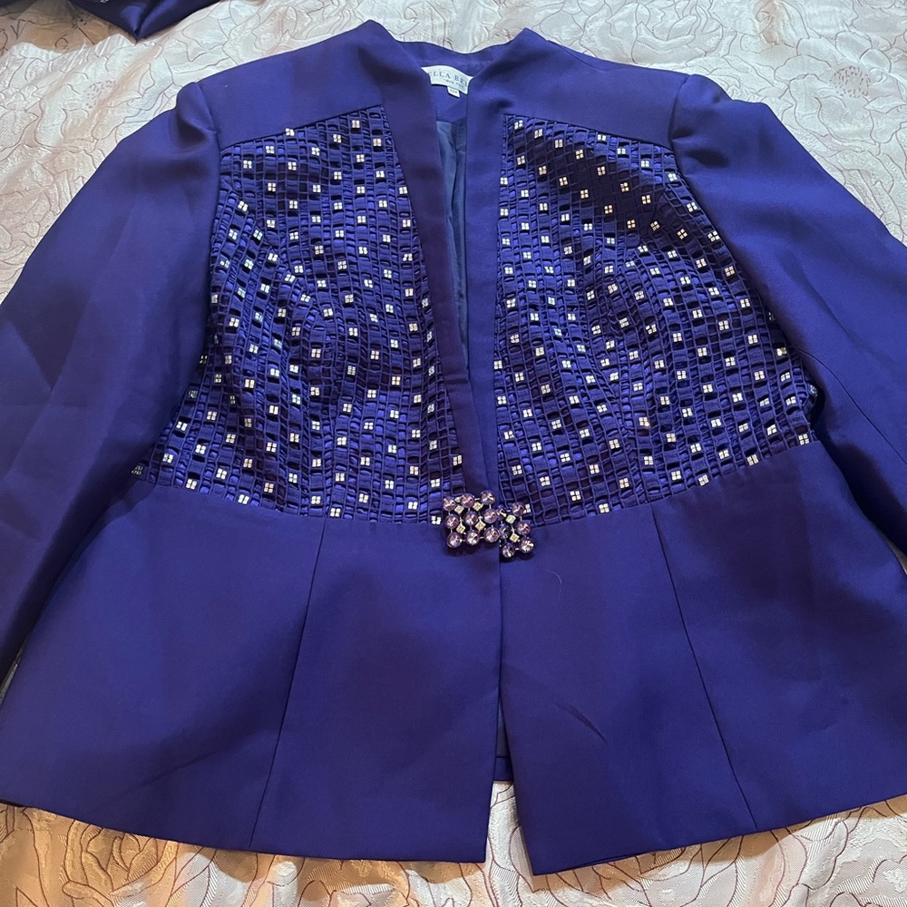 A beautiful three set purple outfit with diamonds all over.